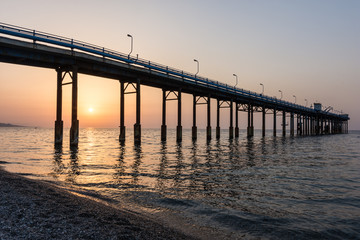 Fototapeta na wymiar Wonderful seascape of a Pier in the sunrise.