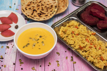 Vegetarian food: pea soup, pilaf, flat cakes, beet cutlets, pumpkin seeds and compote of pickled pears