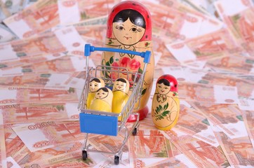 Group of Matryoshka dolls on fake Russian rubles.