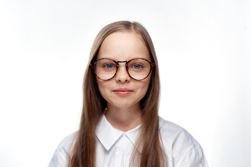 little girl in glasses and in a shirt, portrait