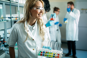 Attractive student of chemistry working in laboratory