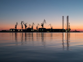Fototapeta na wymiar Shipyard on the sea at the sunset