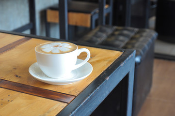 Coffee cup in coffee shop,Cup of coffee on a wooden table,cup of coffee on table in cafe,cup of cappuccino