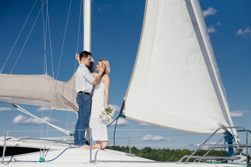 Fototapeta premium couple in love on a yacht, wedding