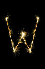 English alphabet from sparkler on black background,Alphabet big letter