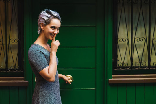 Woman holding door handle