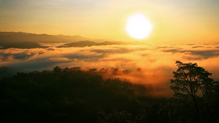 Sunrise over mountain and fog