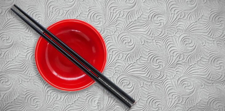 Composite image of close up of chopstick and bowl