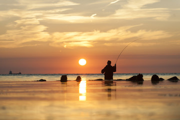 Fototapeta premium flyfishing man at dawn