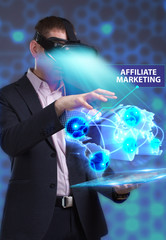 Business, Technology, Internet and network concept. Young businessman working in virtual reality glasses sees the inscription: Affiliate marketing