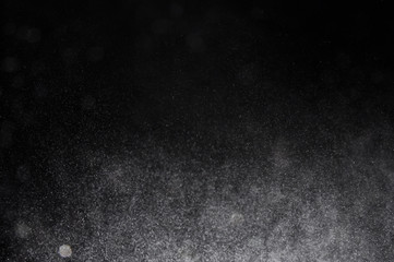 Snowstorm texture,Water dust in motion like snow on black,Watercolor background
