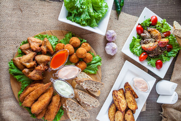 meat plate with sauces and bread for lunch