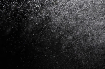 Snowstorm texture,Water dust in motion like snow on black,Watercolor background