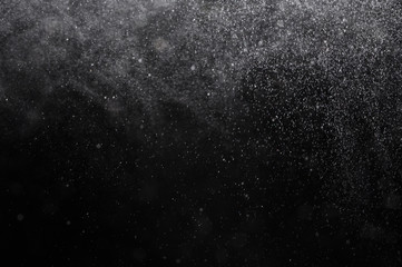Snowstorm texture,Water dust in motion like snow on black,Watercolor background