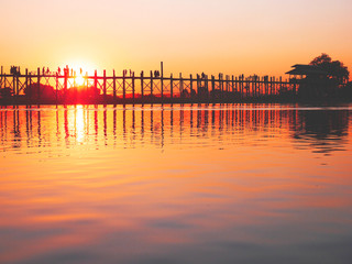 Colorful sunset in Myanmar with a bridge background