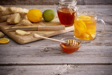  Ginger tea and ingredients on a  grunge wooden background