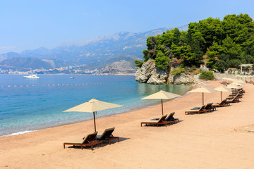 Sunbeds with seaview on the luxury sandy beach in Montenegro