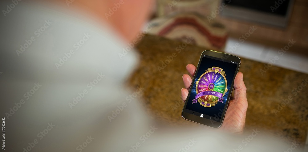 Poster composite image of colorful wheel of fortune on mobile display