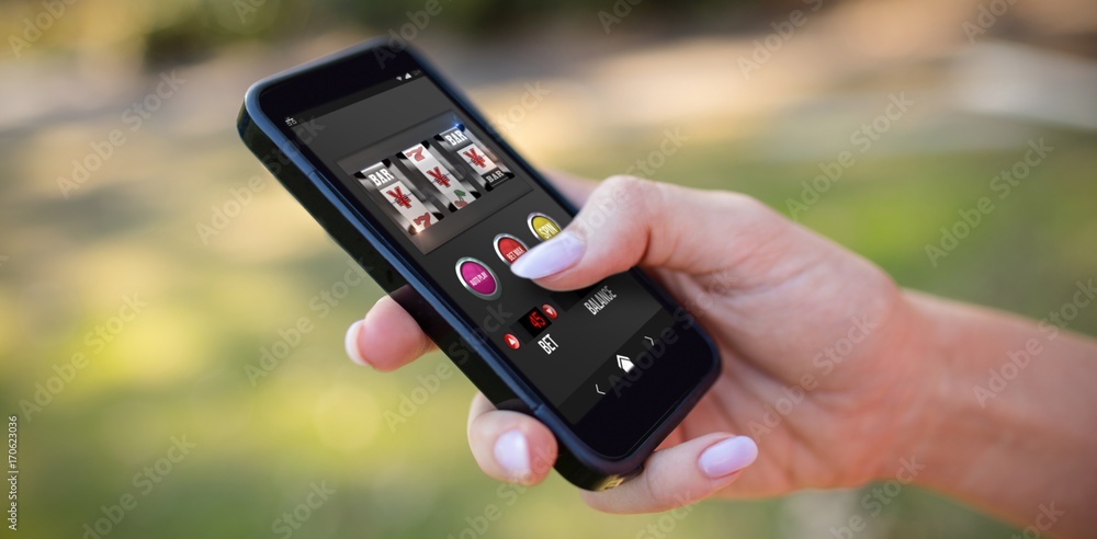 Poster composite image of slot machine app with yen sign on mobile
