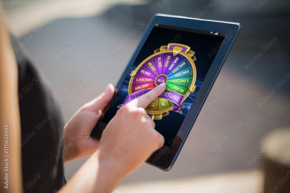 Poster composite image of colorful wheel of fortune on mobile display