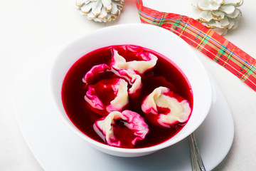 Red borsch with dumplings, traditional Polish Christmas Eve dish