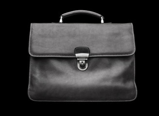 Expensive leather briefcase on a black background.
