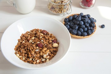 healthy breakfast homemade baked granola or muesli with fresh blueberries white background