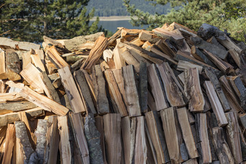 Firewood logs stacked in piles