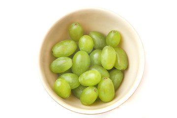 grapes in a bowl on a white background