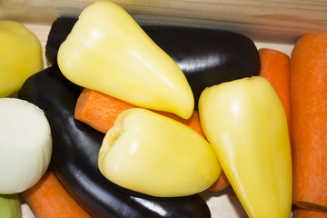 Fresh vegetables. Colorful background of vegetables. Healthy vegetable. Assortment of fresh vegetables close-up. Rich food. eggplants, carrots, onions, bell peppers, zucchini