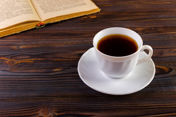 Cup of coffee on a wooden table