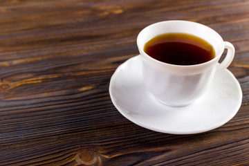 Coffee cup top view on wooden table background