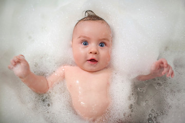 baby bathing in foam