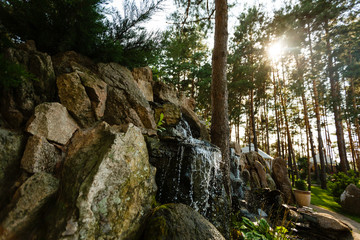 Close up of water splashing on rocks from a waterfall Water on decorative stones