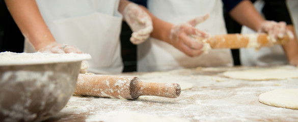 Manufacture of dough products. Hands closeup