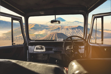 View on the dashboard of the car. Bromo mountains is in front of the car. © Khritthithat