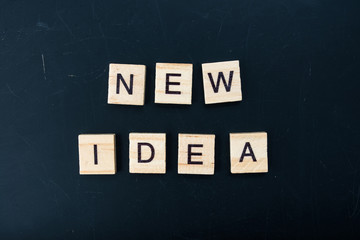 The letters on the black background form the text "new idea"