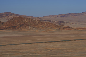 Pan American Highway (Ruta 5) running through the harsh and arid landscape of the Atacama in northern Chile.