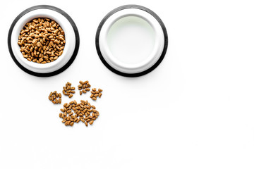 dry pet - cat food in bowl on white background top view mock up