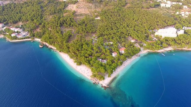 Aerial driving off from small hidden beach on Croatian coast.