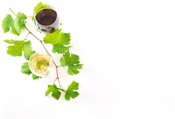 Red white wine glasses green leaves white background