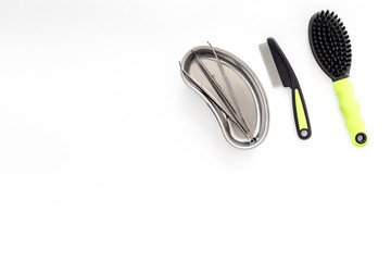 dogs and cats hospital equipment for pet cure set with brushes white background top view space for text
