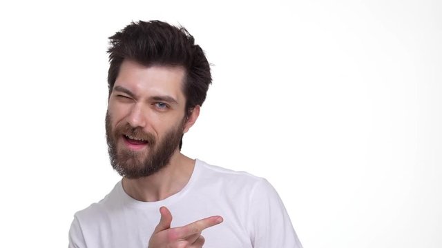 Attractive man friendly smiling Yeah gesture on white background