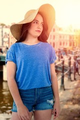 Composite image of brunette women wearing summer hat 