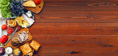 meat, toast and vegetables for a sandwich