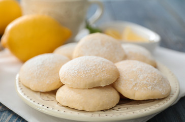 Plate with homemade lemon cookies on table, closeup