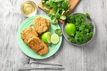 Broccoli pancakes served with lime on plate