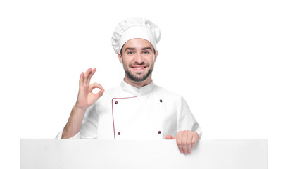 Young male chef with poster isolated on white