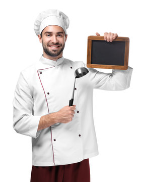 Young male chef with chalkboard isolated on white