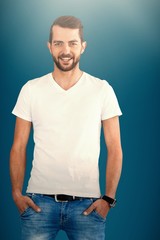 Composite image of smiling fashion model with hands in pockets